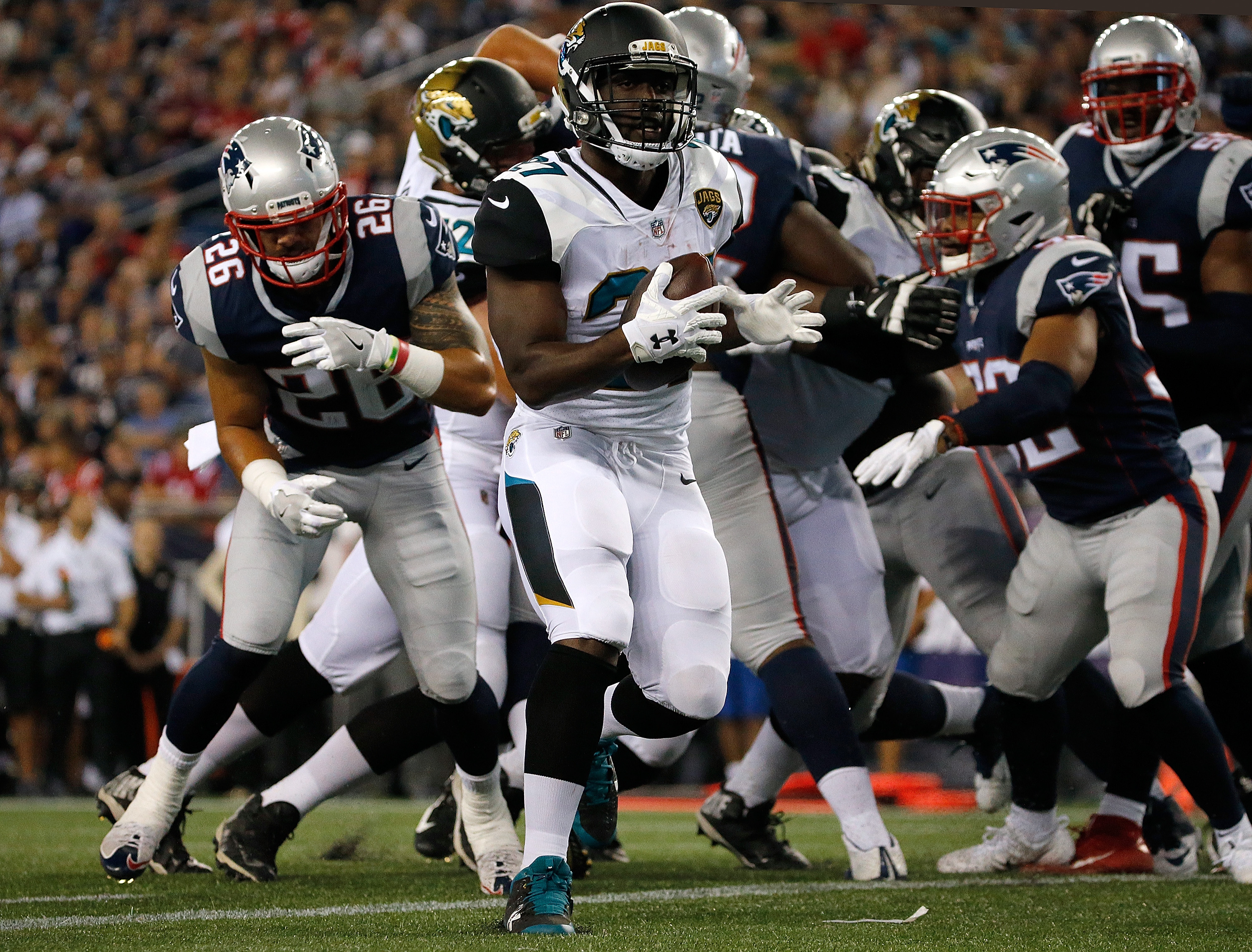 Jacksonville Jaguars running back Leonard Fournettte (27) celebrates 4-yard  touchdown run against the New England Patriots in the second quarter of the  AFC Championship game at Gillette Stadium in Foxborough, Massachusetts on